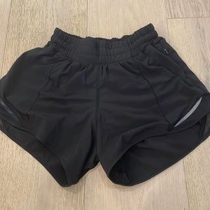 lululemon hotty hots, size 2, 4”, black athletic shorts.